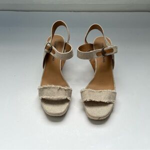 Lucky Brand Woman’s Gold Wedge Sandals in a size 8. New W/O tags or box.
